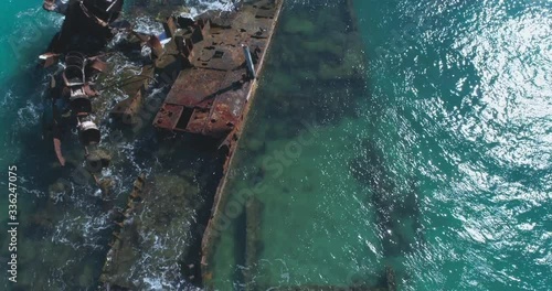Cinematic 4k aerial video close up of rusty Shipwrecks in Turquoise Waters