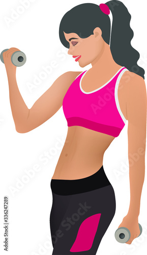 Beautiful girl with dumbbells in her hands goes in for sports in a fitness club
