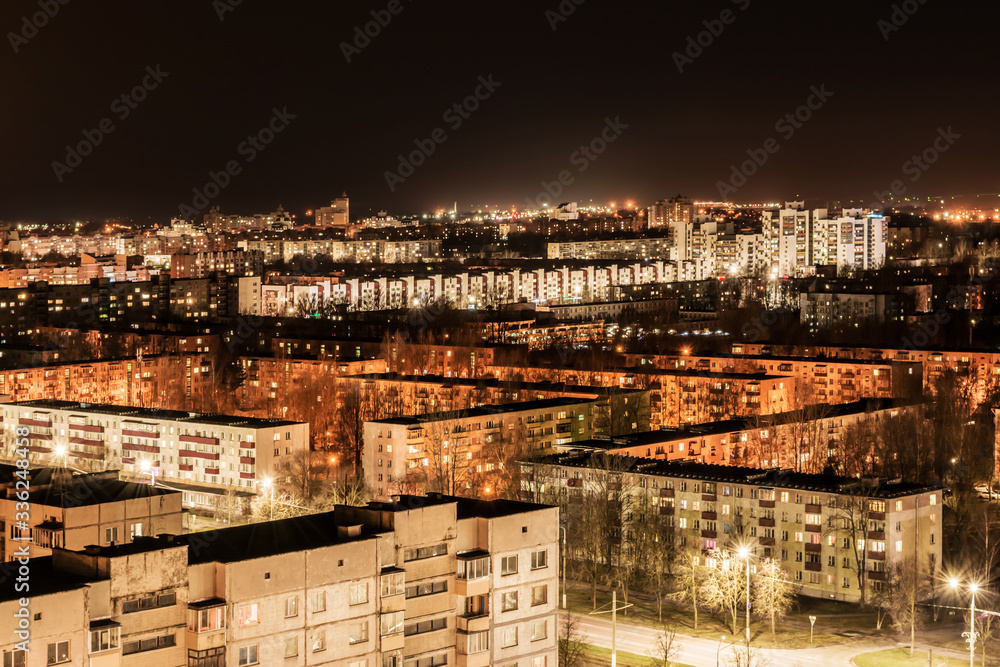 Fototapeta premium night view of nine-story houses and streets with lanterns, Belarus Vitebsk, architecture abstract background