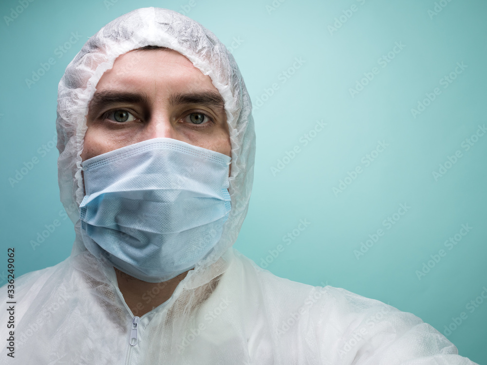 Man in protective suit and medical mask Man in protective suit and medical mask