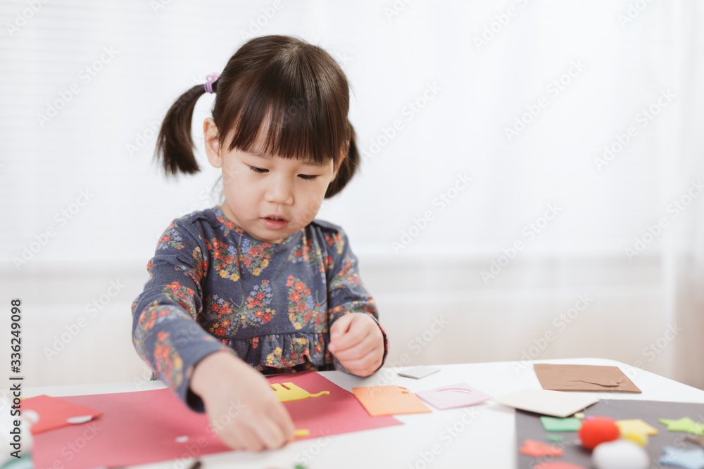 toddler girl making craft for homeschooling toddler girl making craft for homeschooling