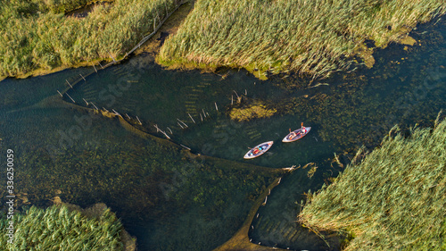 Aerial view of kayakers on Norin river in Neretva valley, Dalmatia, Croatia. photo