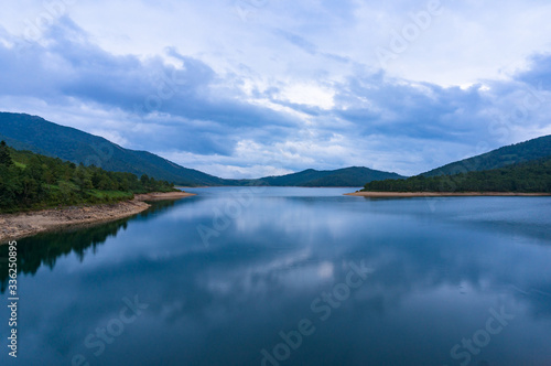 Mountain lake landscape. Nozori lake, dam surrounded by mountains