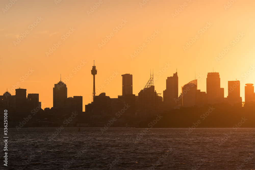 Sydney cityscape with bright orange sky and Sydney CBD skyscrapers