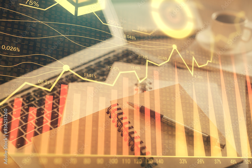 Fototapeta premium Double exposure of financial chart drawing and desktop with coffee and items on table background. Concept of forex market trading
