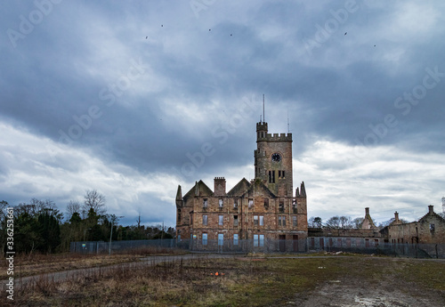 The remains of the abandoned Hartwood Hospital, a 19th century psychiatric hospital with imposing twin clock towers located in Scotland. Recent filming location for the new Batman movie  photo