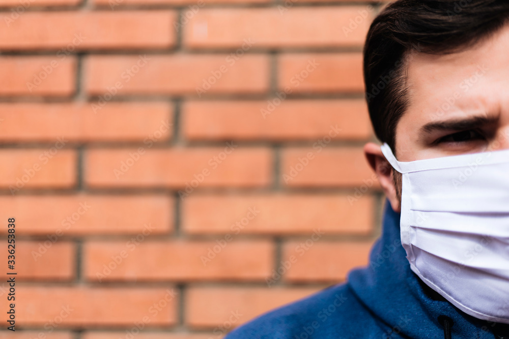 Middle face man is looking the camera with a medical mask Middle face man is looking the camera with a medical mask