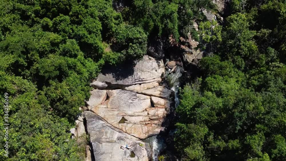 some rocks in the middle of the forest near a river, filmed from above by the drone. some rocks in the middle of the forest near a river, filmed from above by the drone.