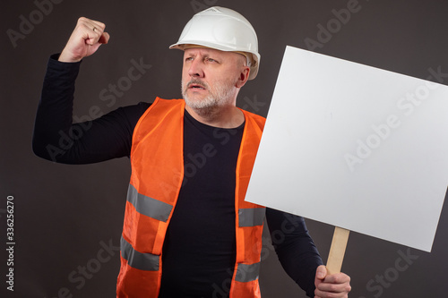 Builder with a banner. Conc...