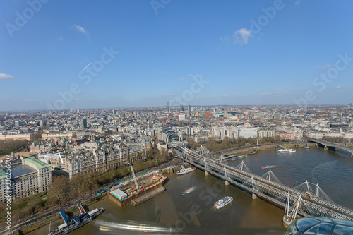 A panoramic aerial view of the Thames river at the Hungerford Bridge crossing in London UK.