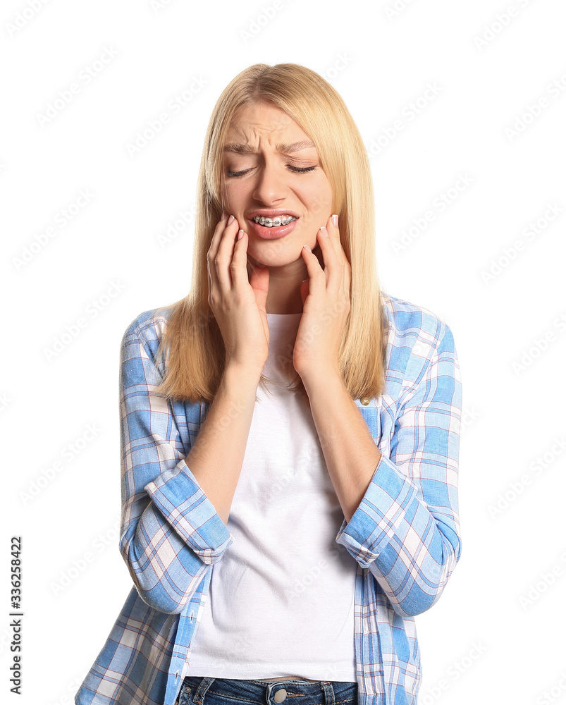 Stressed woman with dental braces on white background Stressed woman with dental braces on white background