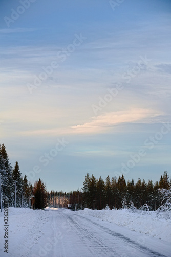 View over winter road in Swedish forest