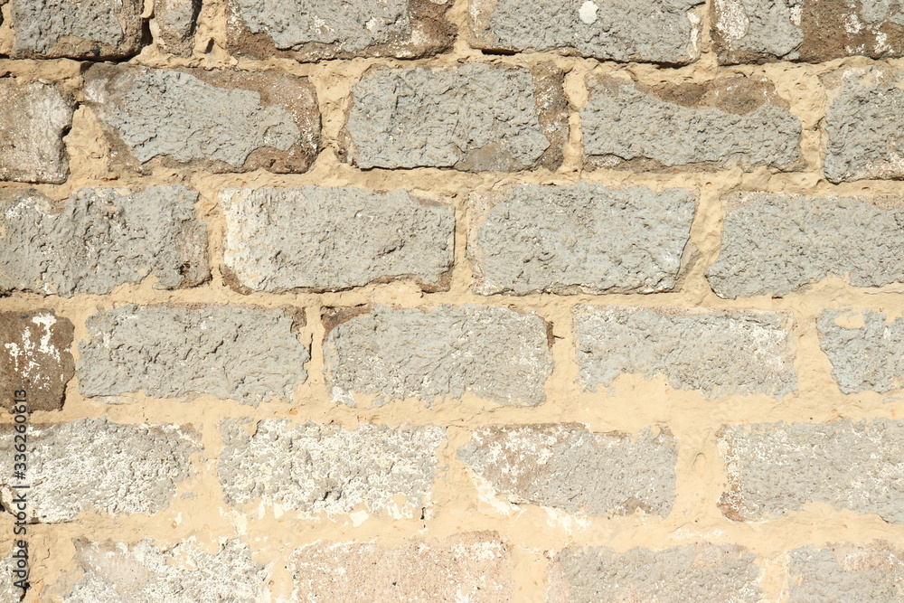 Fototapeta premium Stone wall as a background.Decorative natural stone. Natural decoration of the facade of the house, building