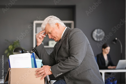 Stressed senior businessman...