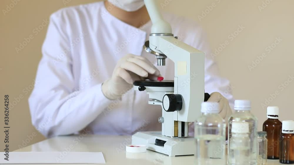 Scientist looks at medical samples under microscope and reports a negative result Scientist looks at medical samples under microscope and reports a negative result