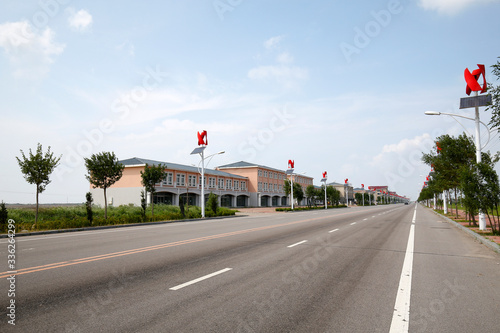 Beautiful roads and street lamps against a background of blue sky and white clouds