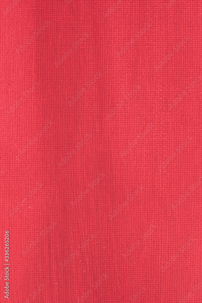 Fototapeta premium Abstract hand painted red canvas background texture.
