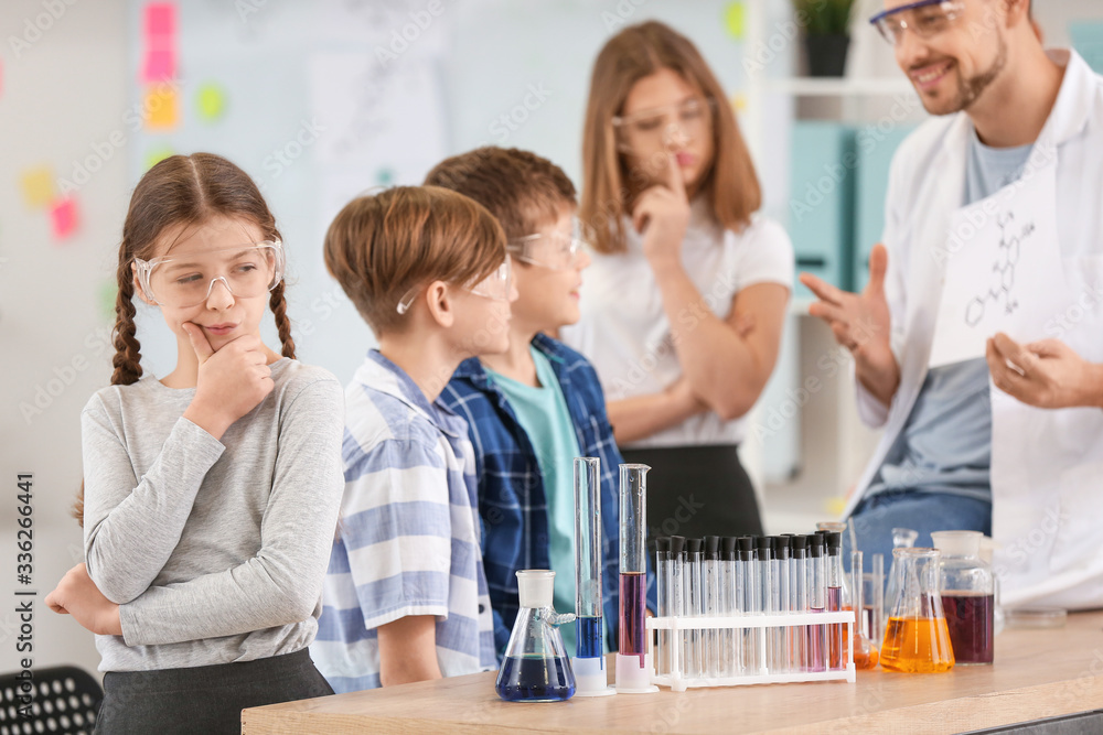Fototapeta premium Pupils at chemistry lesson in classroom