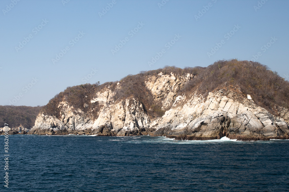 Huatulco bay with blue ocean