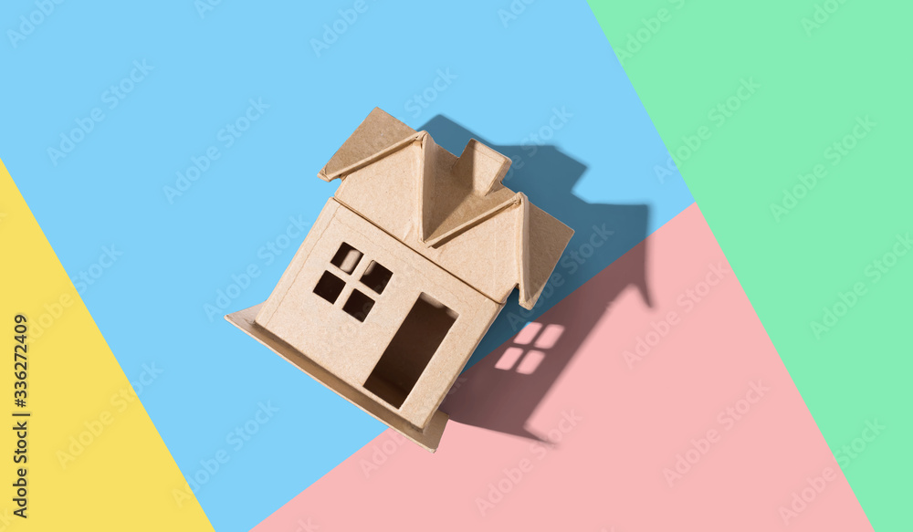 Cardboard house with drop shadow overhead view