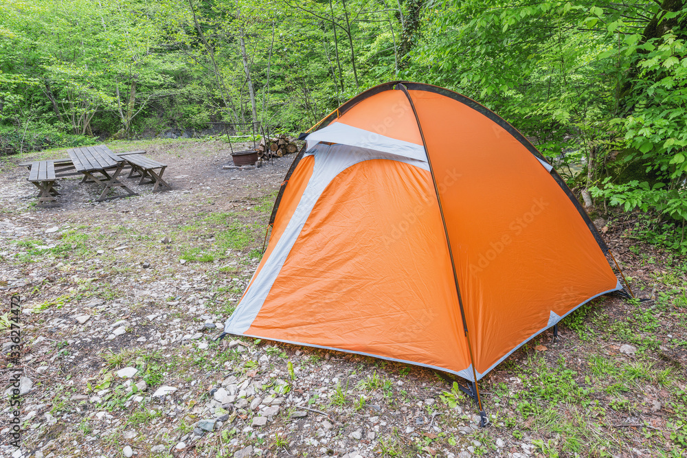 Orange tent in the camping in the forest. Orange tent in the camping in the forest.