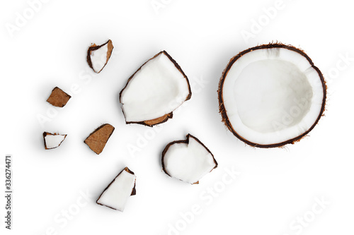 Whole coconut and pieces of coconut on white background