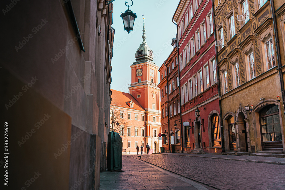 The Royal Castle of Warsaw at the end of a street in the old town of Warsaw