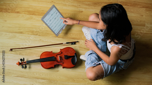 young woman playing violin practic violin learning  music photo