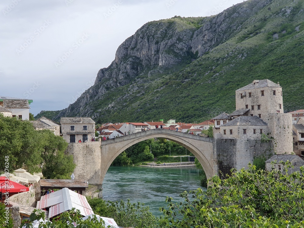 Bridge over river with beautiful town background and hills, Bosnia