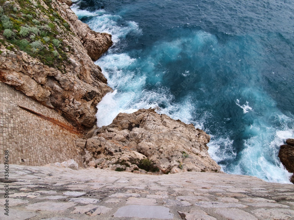Beautiful image of waves crashing on rocks in Croatia.