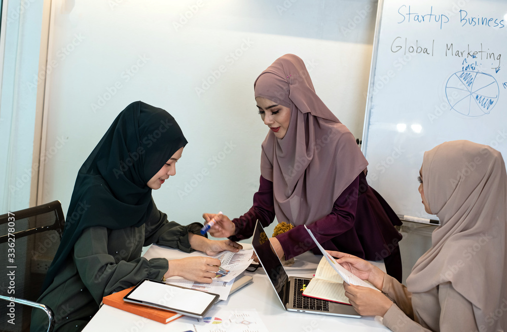 Three business women doing paper work together,at meeting room,office busy time Three business women doing paper work together,at meeting room,office busy time