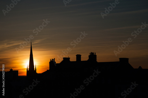 silhouette of the church and buildings at dusk