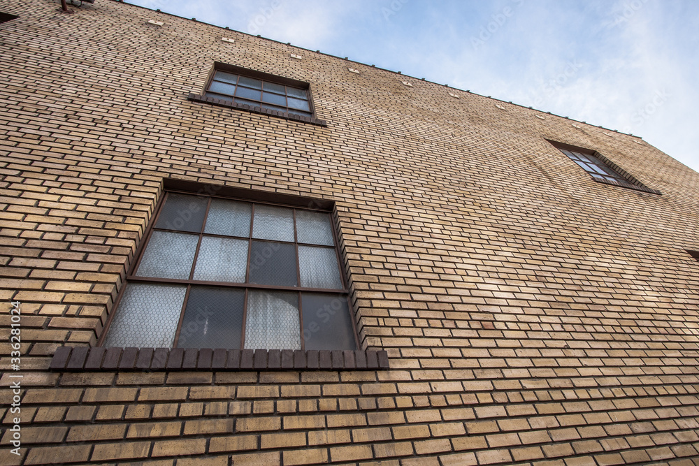 brown brick wall with window