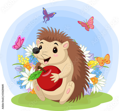 Cartoon baby hedgehog holding apple in the grass
