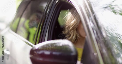 4K Policeman arresting & cuffing a female crime suspect at the roadside. Slow motion.