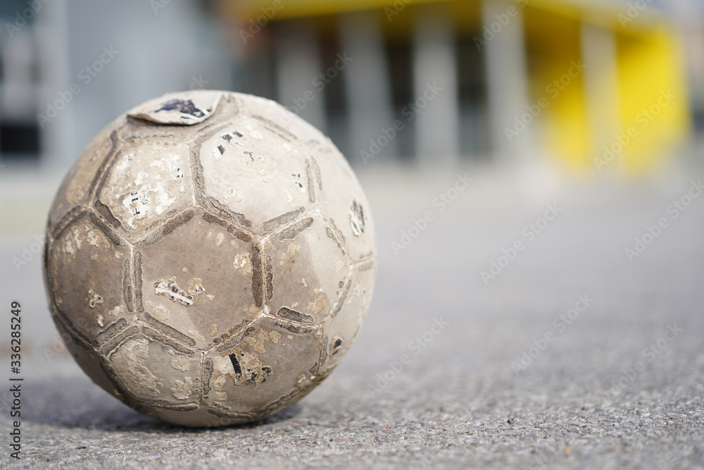 Old Soccer ball in field