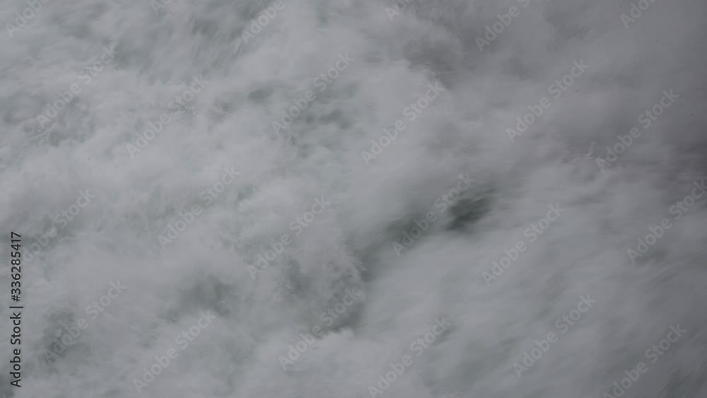 Massive streams of water at a waterfall in Schaffhausen on the river Rhine Massive streams of water at a waterfall in Schaffhausen on the river Rhine