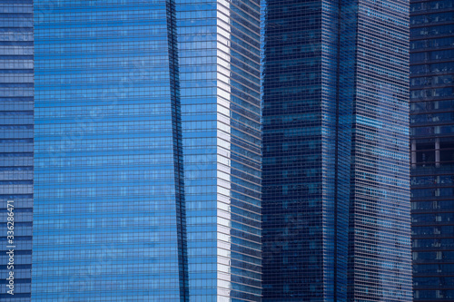 High glass skyscrapers on the streets of Singapore. Office windows background  closeup