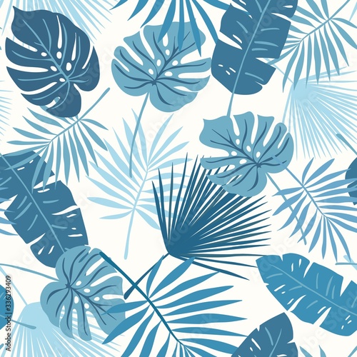 Tropical seamless repeat pattern with tonal blue green teal leaves of different shapes on a soft ivory cream vanilla background