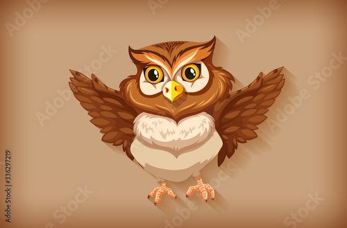 One cute owl on brown background