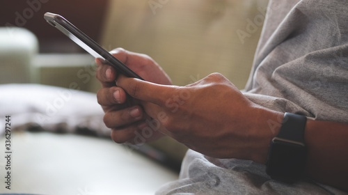 Cropped shot view of Man generation of creative use technology together of smartphone, table and laptop, internet lifestyle generation.