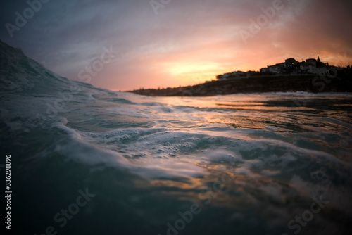 Splashing waves at sunset, Tamarama Beach, Australia