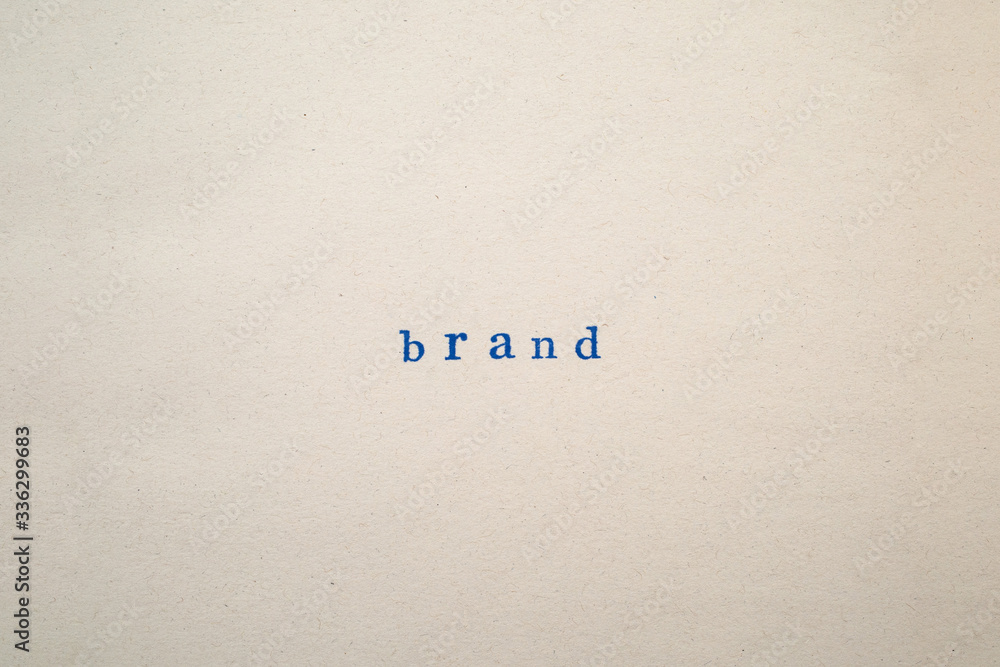 a BRAND word stamped on a piece of paper. a BRAND word stamped on a piece of paper.