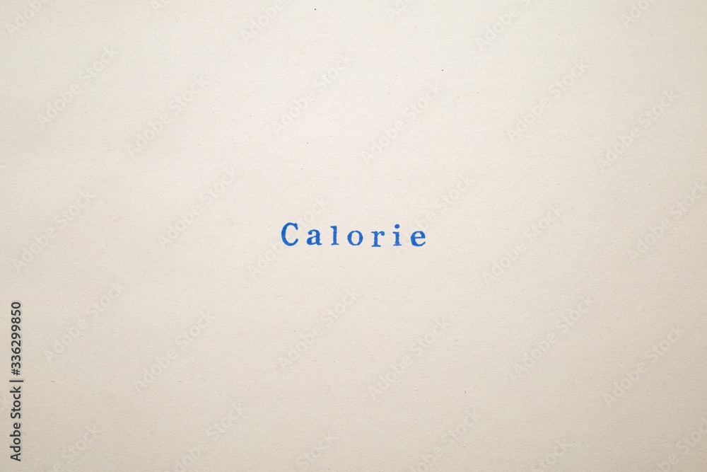a CALORIE word stamped on a piece of paper. a CALORIE word stamped on a piece of paper.
