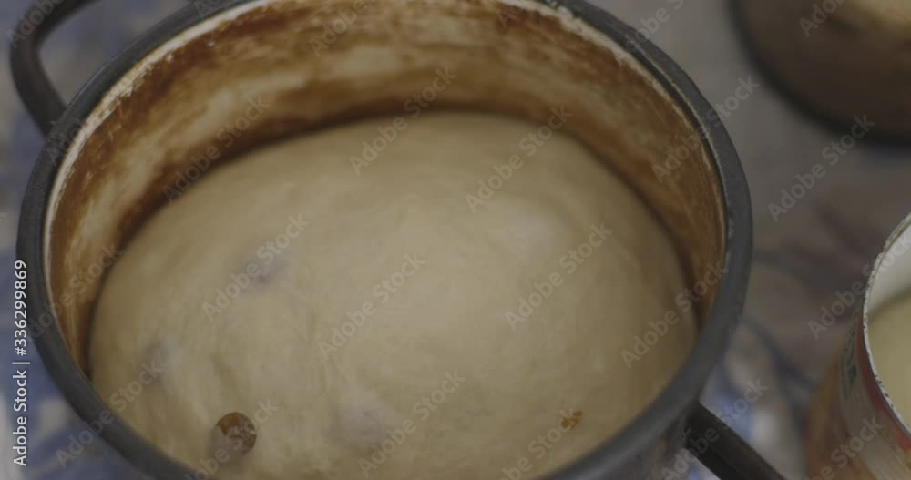 Grandmother cooking, preparing dough in flour, . Senior woman baking pastry in her home kitchen. Easter holiday Grandmother cooking, preparing dough in flour, . Senior woman baking pastry in her home kitchen. Easter holiday