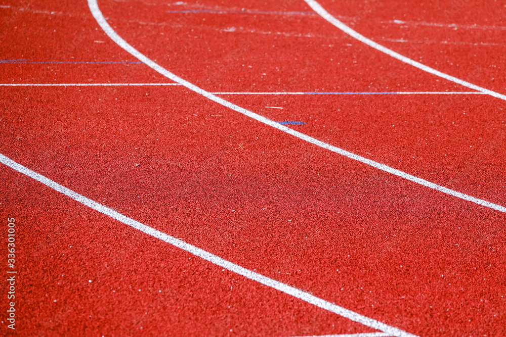 Athletic running track for running race. Sport and excercise concept. Athletic running track for running race. Sport and excercise concept.