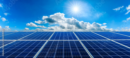 Photovoltaic solar power panel on sky background,green clean alternative energy concept. photo