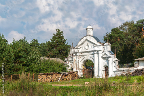 Antique entrance to the territory of the rural orthodox church and cemetery
