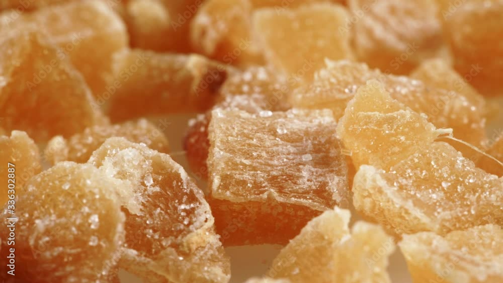 Close up heap of crystallized candied ginger pieces rotating. Yummy snack, better alternative to candy Close up heap of crystallized candied ginger pieces rotating. Yummy snack, better alternative to candy
