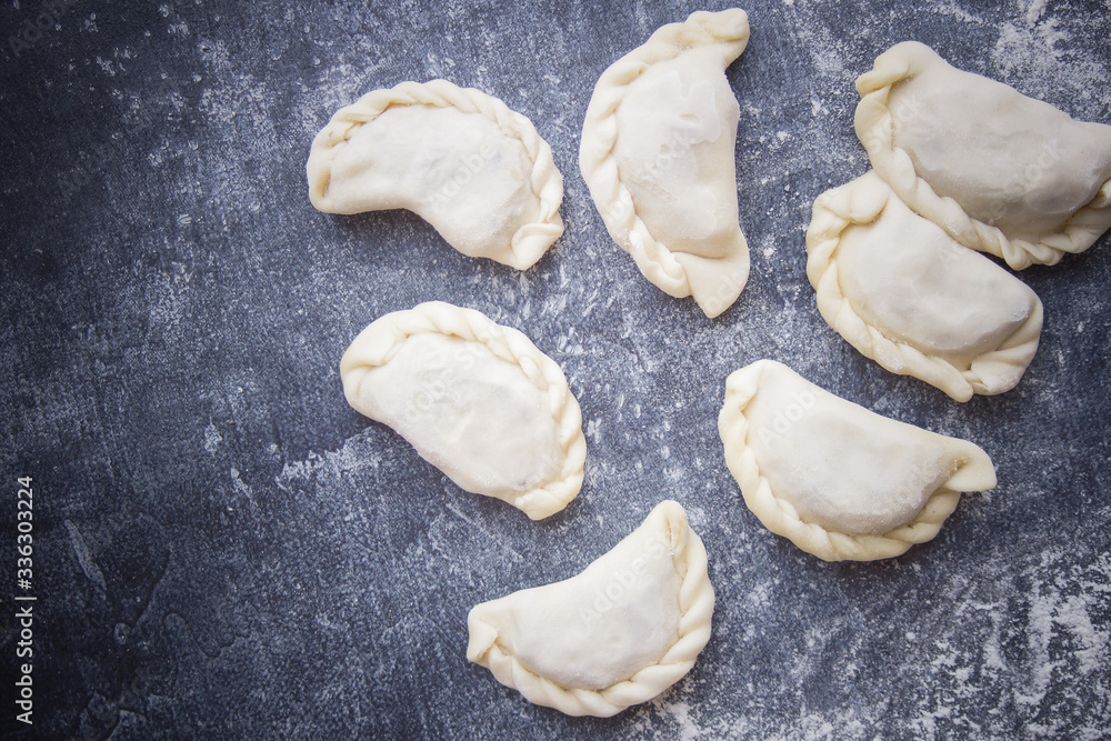 Dumplings, Russian cuisine, Dark background Dumplings, Russian cuisine, Dark background